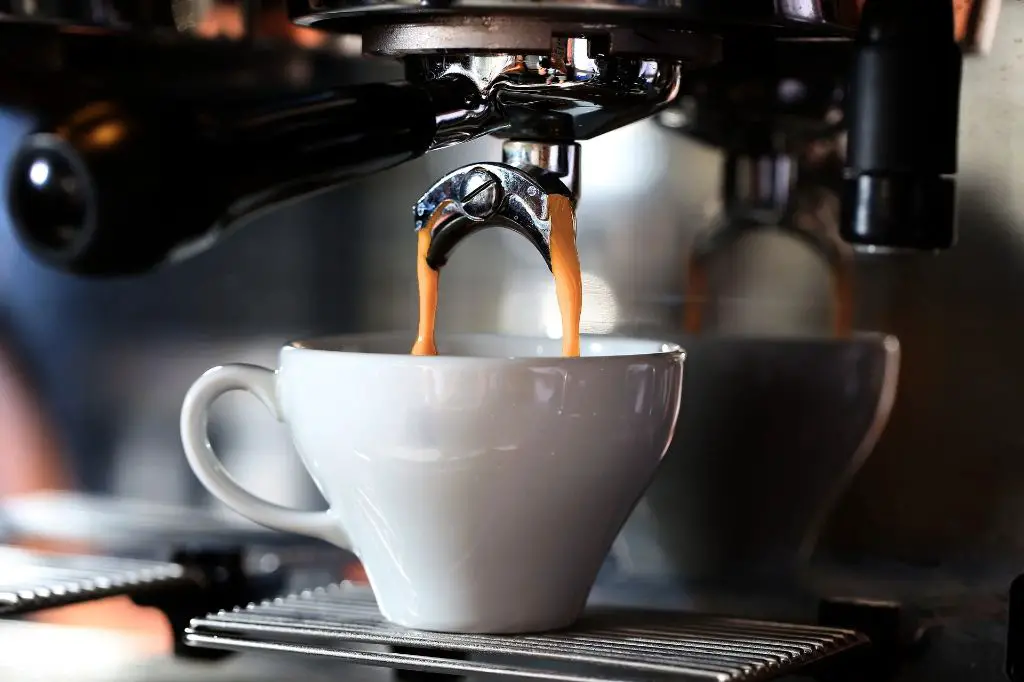 a barista preparing an espresso shot