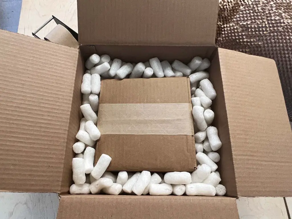 a box from the ceramic shop packed with bubble wrap and fragile stickers