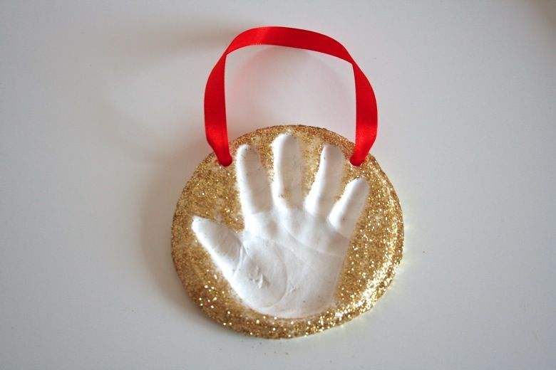 a child's handprint preserved in baked clay.