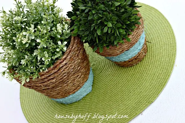a fun way to decorate a plain pot is by wrapping it with rope. this gives the pot a natural, rustic look.
