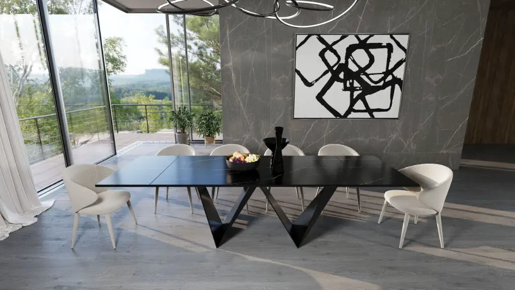 a modern black ceramic dining table with metal legs