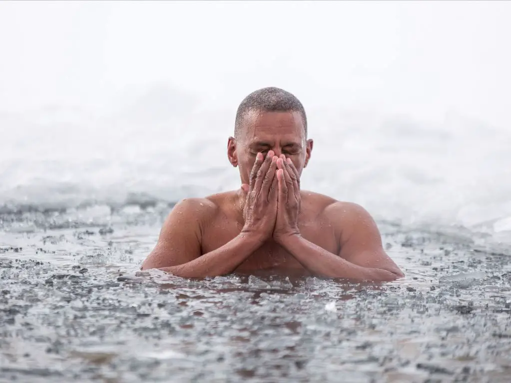 a person jumping into icy water