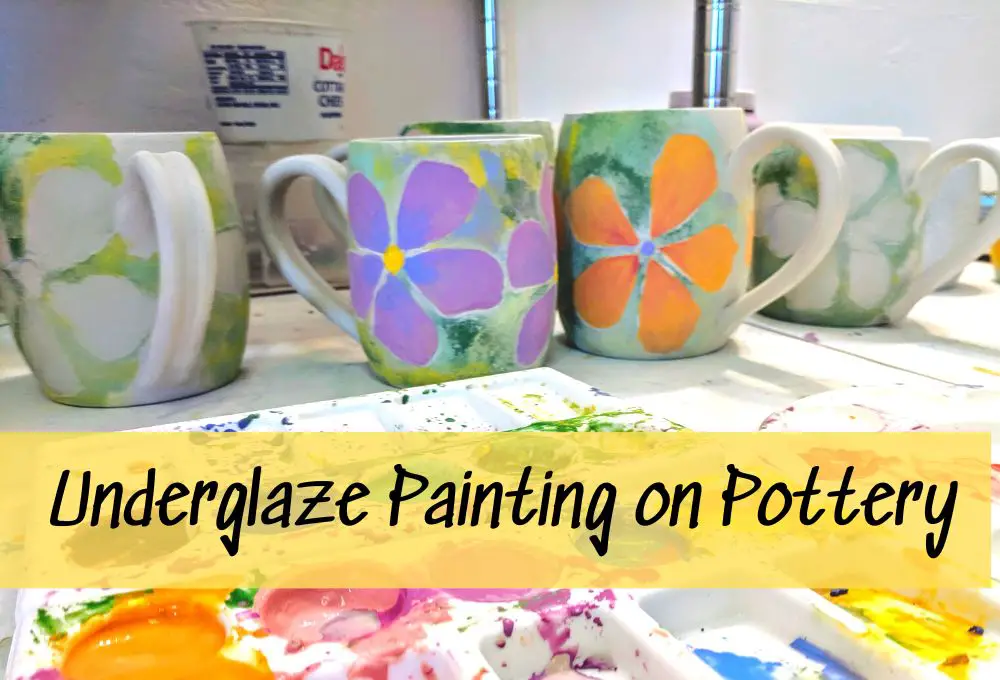 a potter painting delicate underglaze designs on a ceramic piece