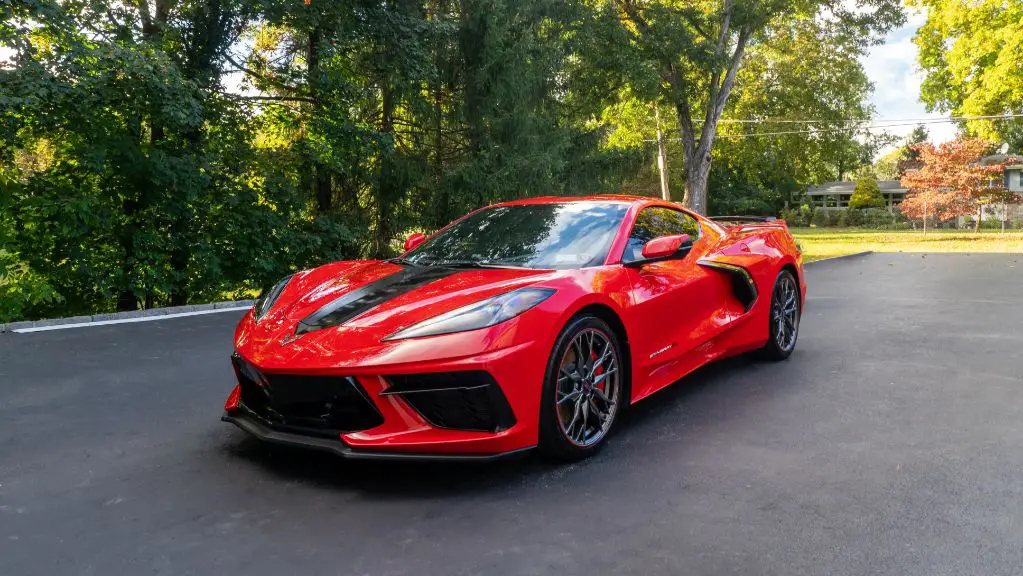 a red ceramic coated sports car shining in the sun