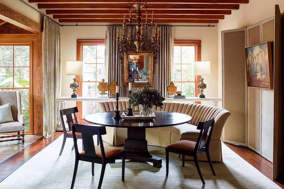 a round dining table viewed from above showing how the curved edges promote better conversation flow compared to sharp corners.