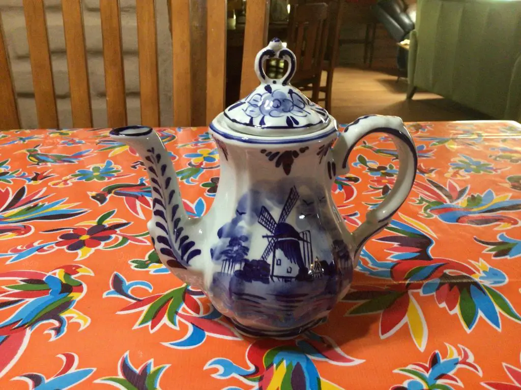 a shop in delft selling traditional blue and white ceramic pots and figurines.