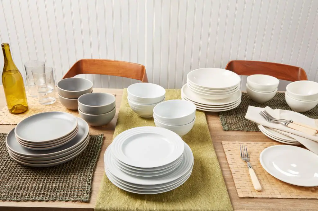 a table set with stainless steel dinnerware, which is a durable alternative to porcelain that won't chip.