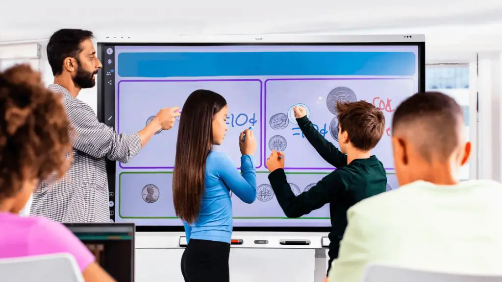 a teacher using a smart board to engage students