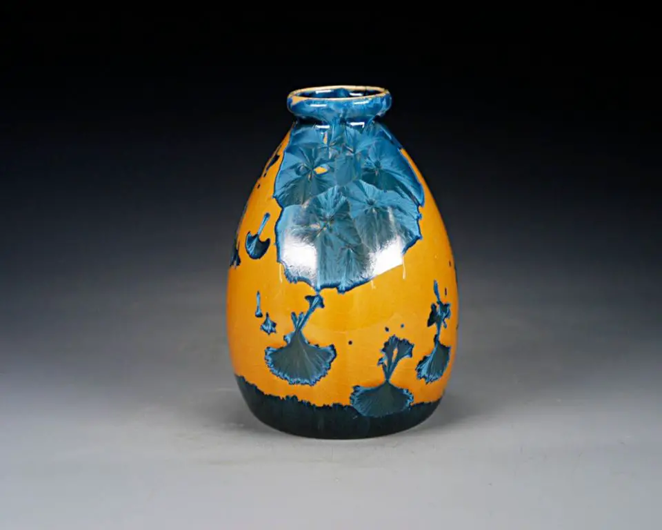 a vase with blue and green crystalline glaze effects