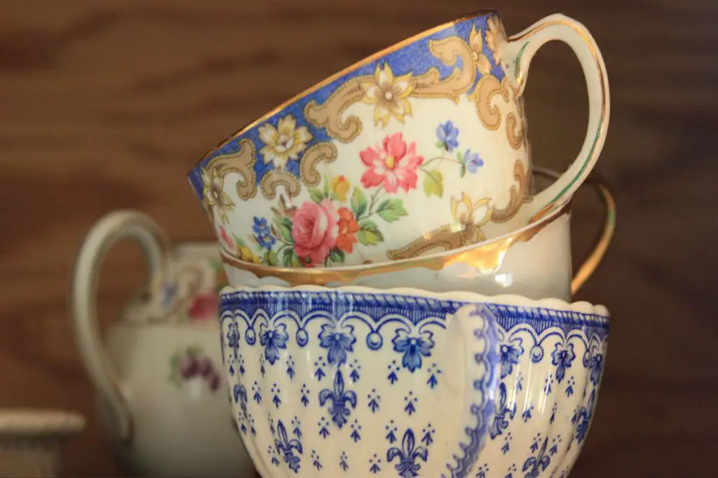 an antique porcelain plate and teacup displayed on a table as an example of collectible china pieces.