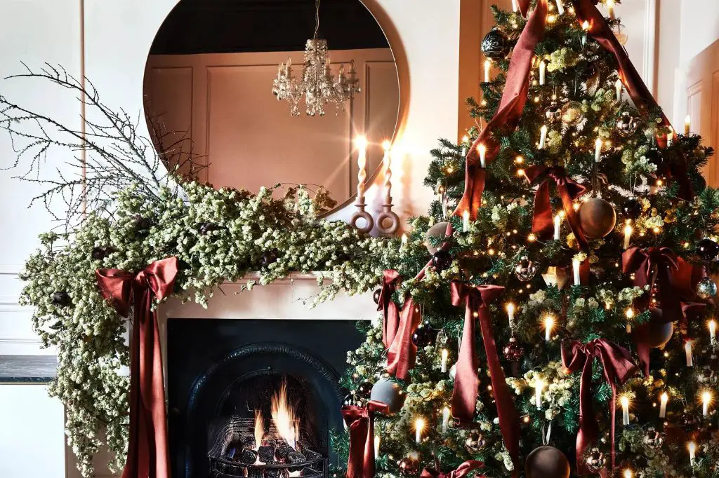 an eclectic christmas decor look layers old and new pieces for a personalized, cozy style.