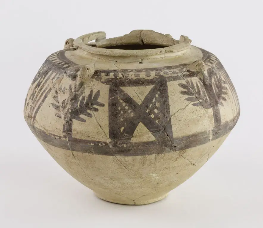an example image of an ancient mesopotamian pottery vessel with an ash glaze.