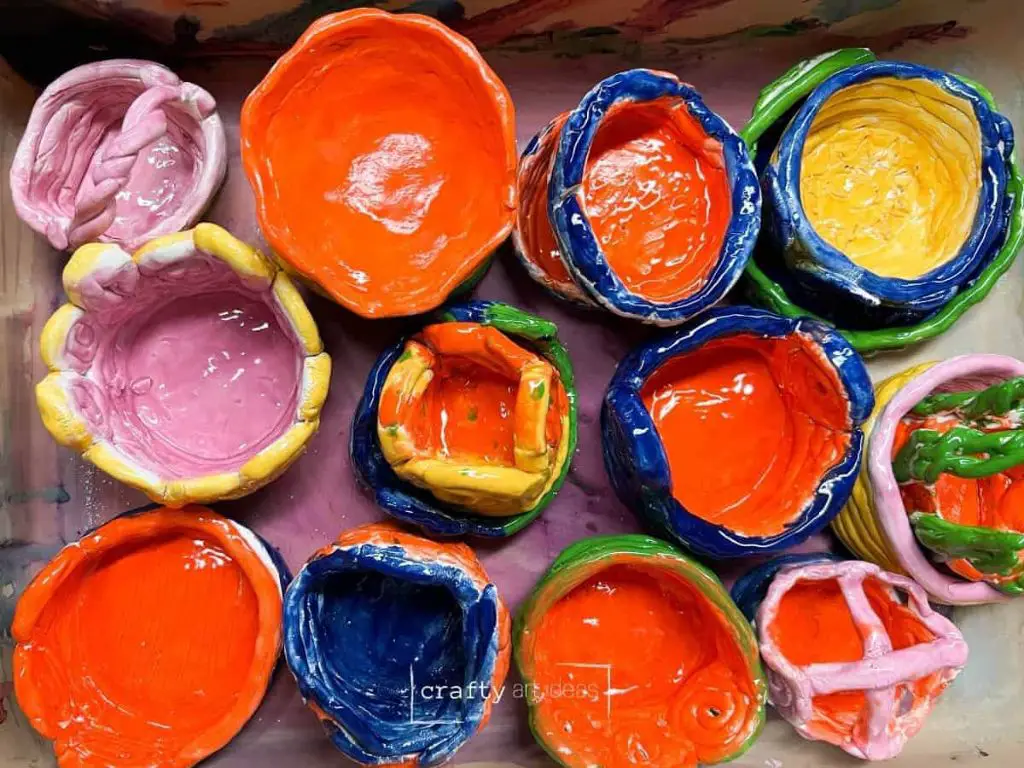 an example image of brightly colored glazed earthenware pottery items.