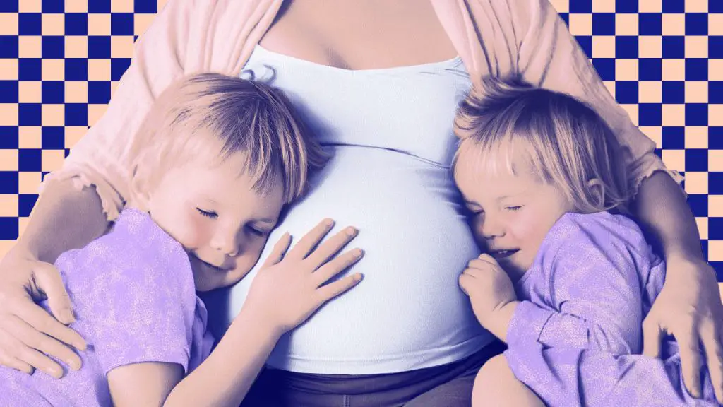 an expecting couple looking at baby items in a store to build their registry checklist