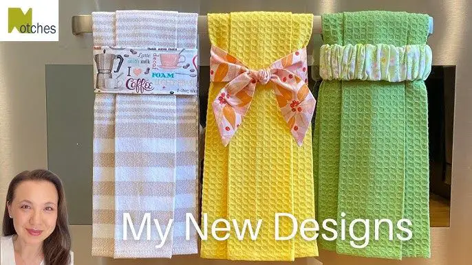 an image of decorative dish towels hanging in a kitchen