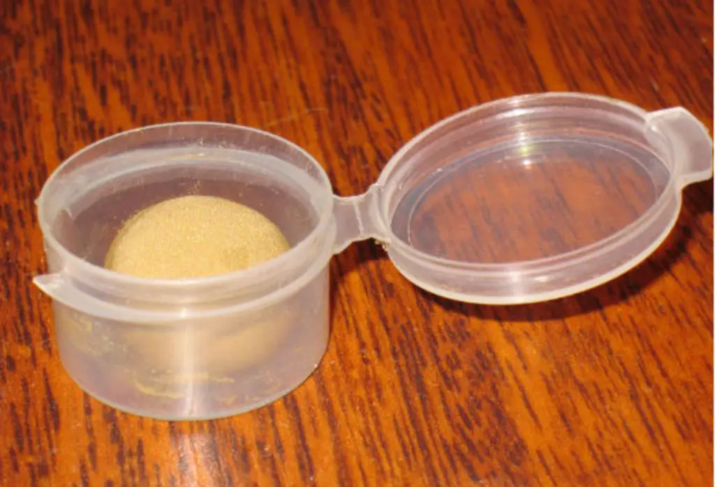 an image showing clay sealed airtight in plastic containers