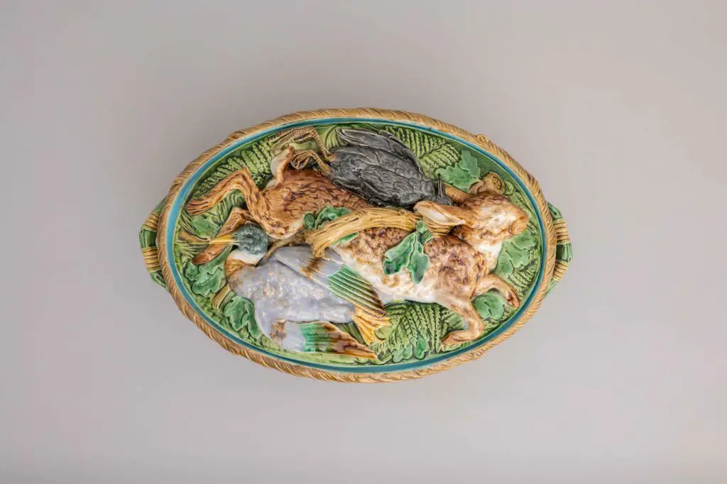 an intricate botanical design on a majolica plate reflects the revival of renaissance styles in victorian era majolica.