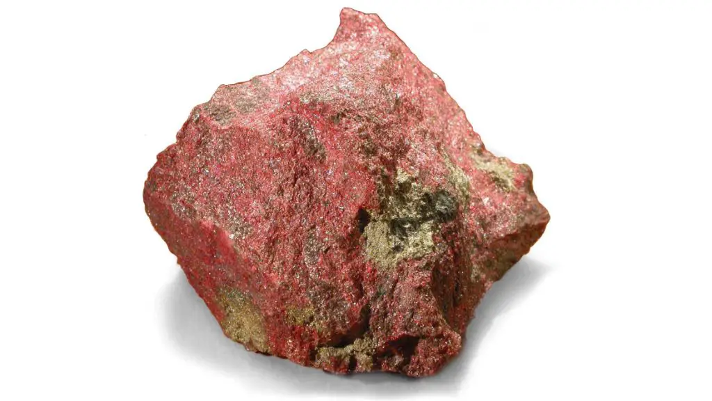 ancient romans grinding iron oxide rocks into red ochre pigment powder