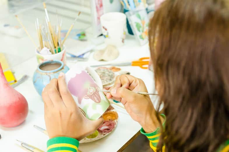 applying stroke and coat underglaze to bisqueware using a soft brush