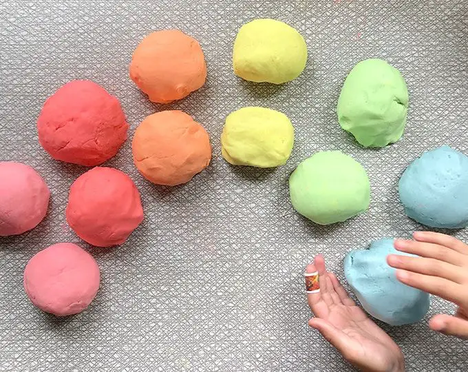 balls of homemade clay dough on a table ready for sculpting