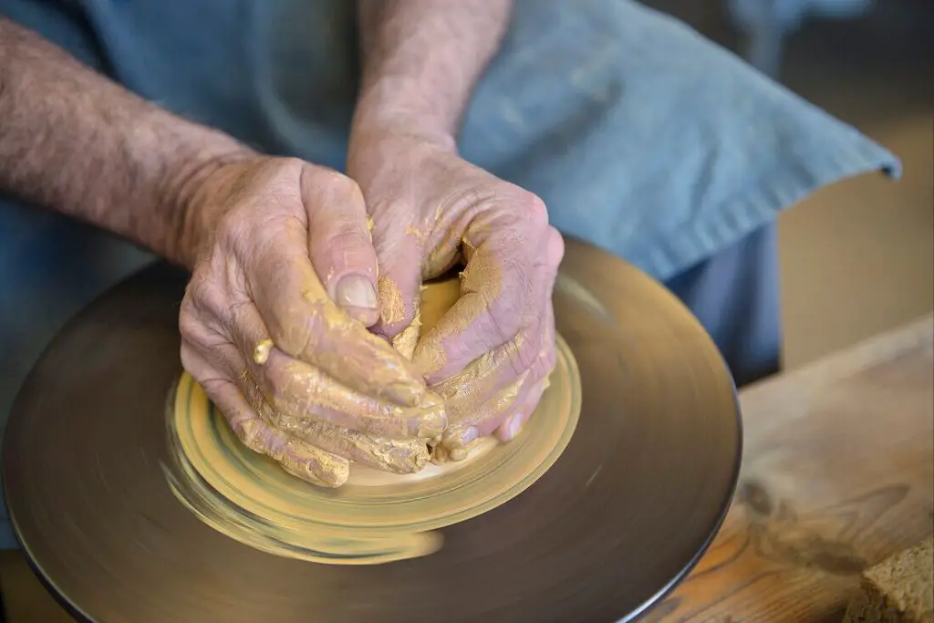 clay being shaped on a potter's wheel