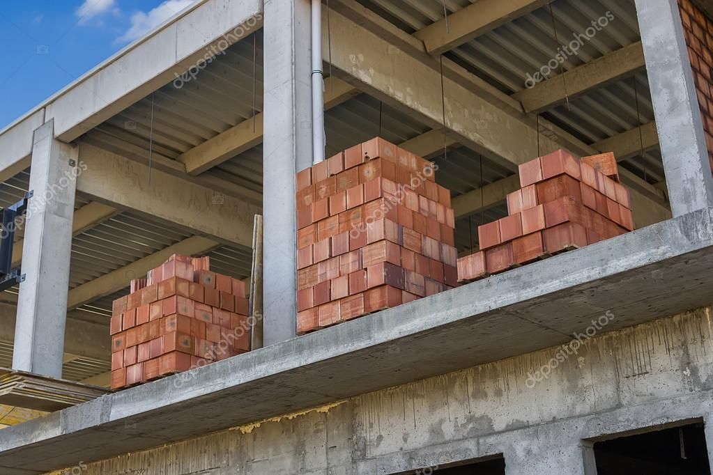 clay bricks stacked to build a wall