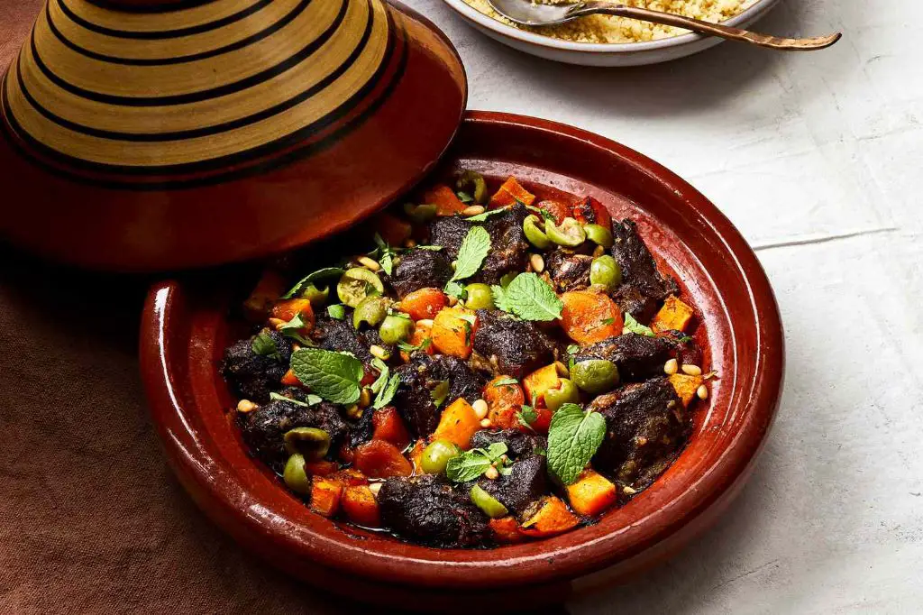 clay pot tagine stew cooking on stovetop