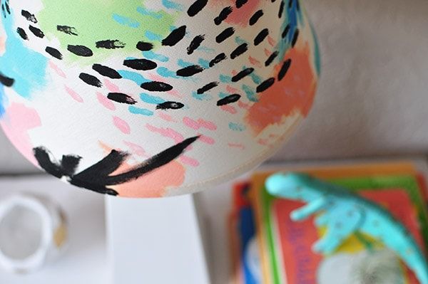 close up of painted lamp shade drying