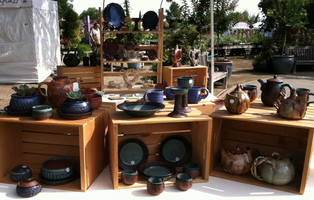 close up of pottery pieces on display at art fair booth