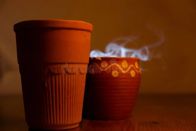 close up photo of an indian clay tea pot