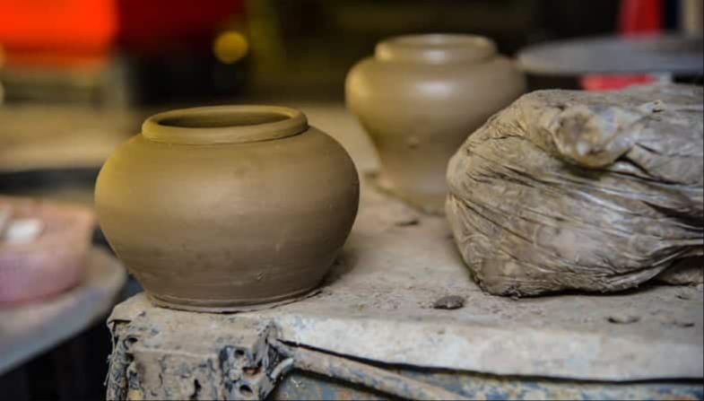 earthenware clays are porous when fired, making them suitable for decorative pieces.
