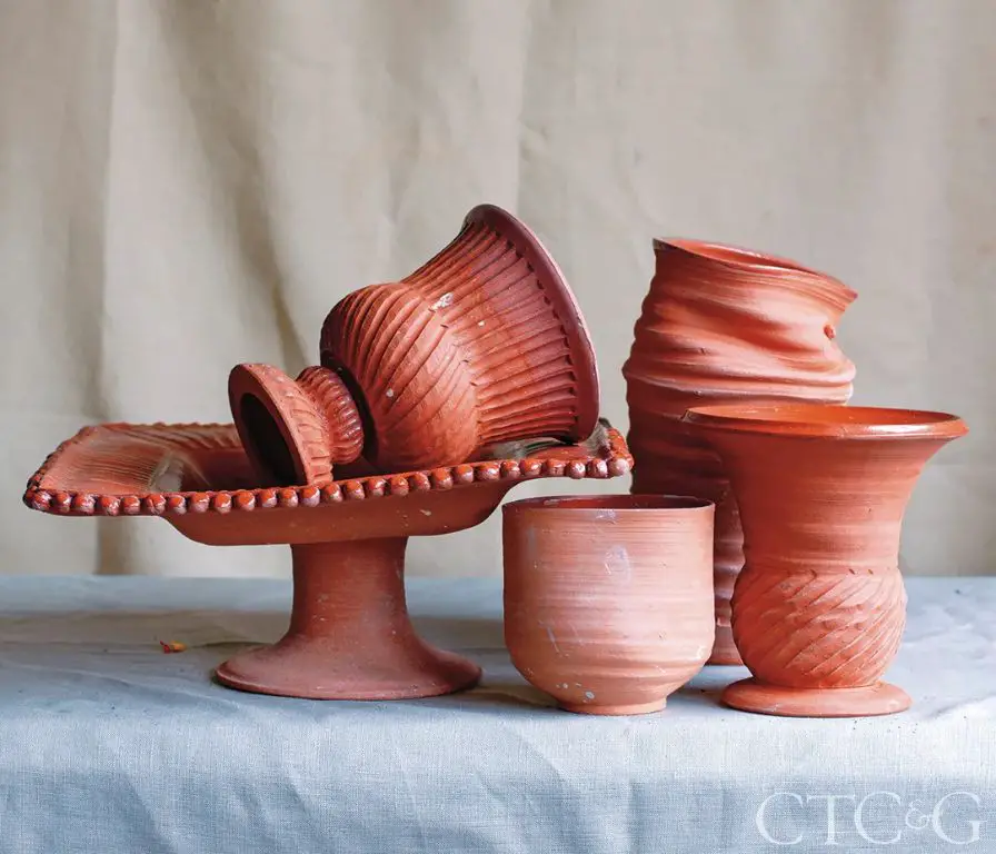 earthenware pieces like this vase tend to have a rough orange color and be more porous than stoneware.