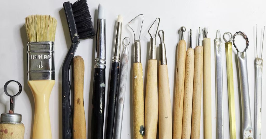 essential clay sculpting tools on a table