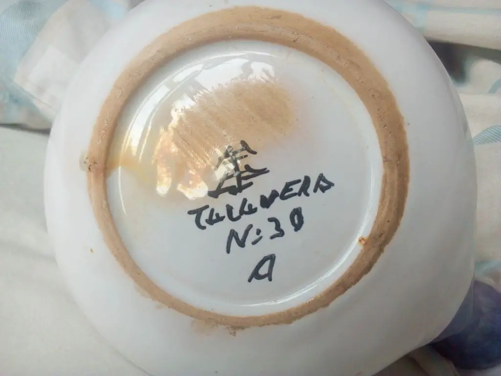 example of a talavera maker's signature on the bottom of a ceramic piece.