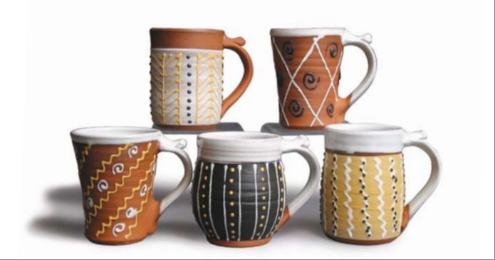 examples of slip trailing decorative designs on clay pottery