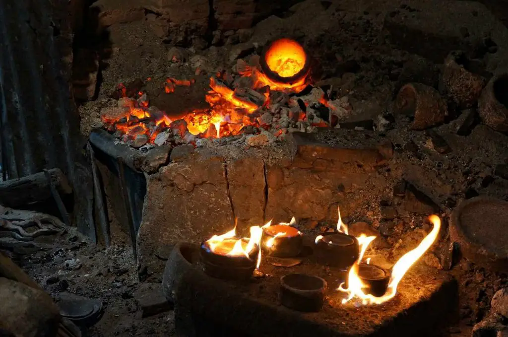 firing ceramic pieces in a kiln involves slowly heating the clay objects to very high temperatures in order to permanently harden and vitrify the clay.