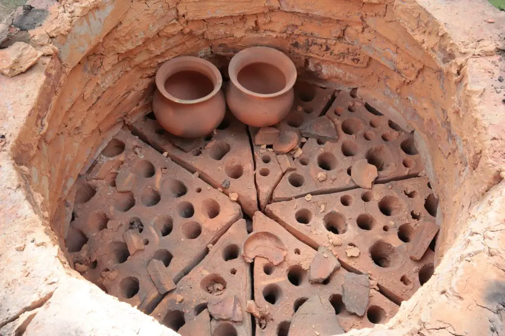 firing pottery pieces in a kiln is an essential part of the pottery making process that requires significant startup costs.