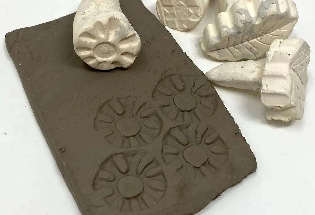 impressing is an easy way to add texture by pressing items into soft clay.