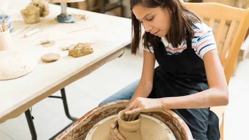 investing in proper equipment like pottery wheels and kilns is a primary startup cost when launching a ceramics business.