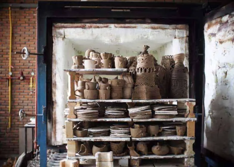 kilns rapidly bake clay objects by providing constant high heat.