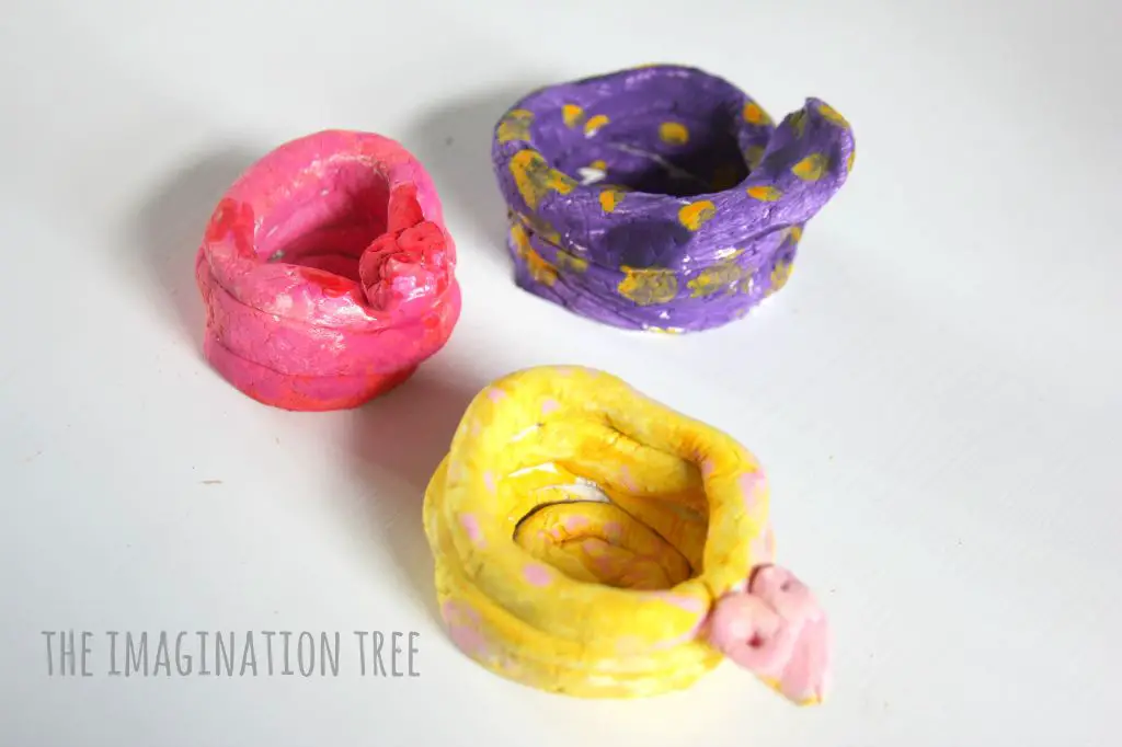 letting kids experiment with different clay techniques like pinch pots helps develop fine motor skills.