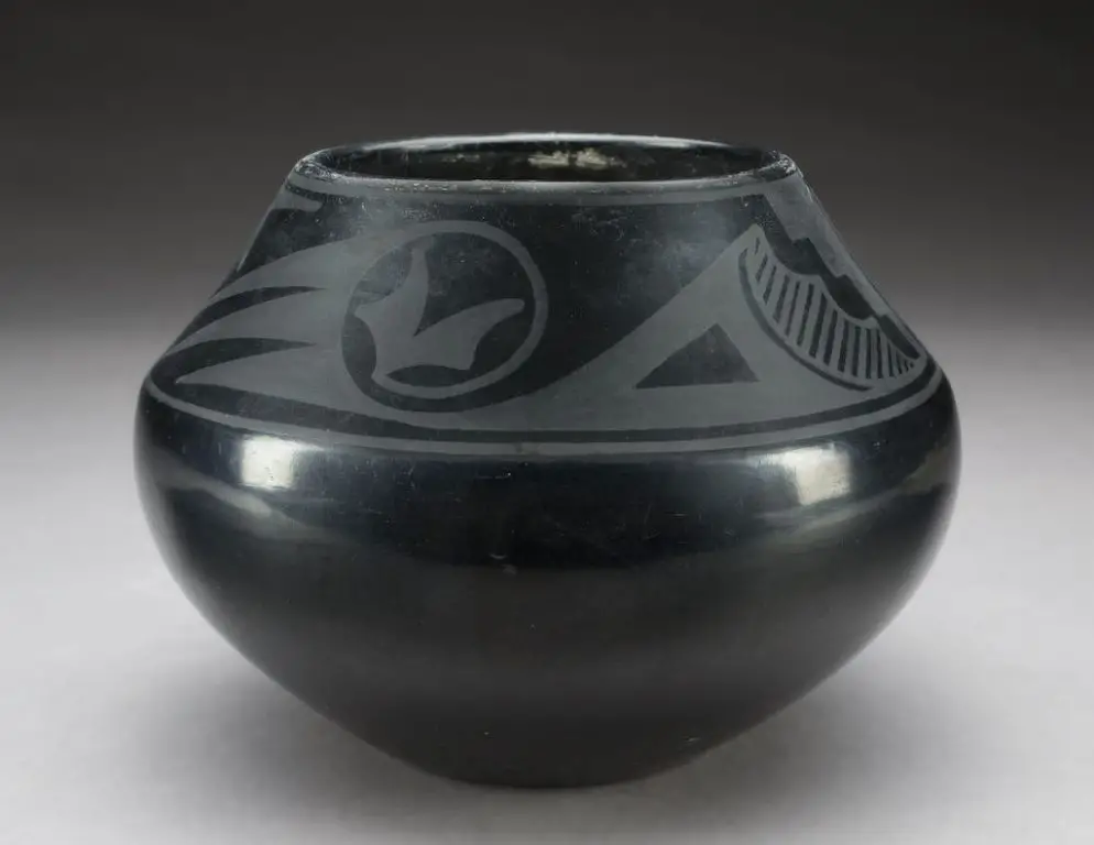 maria martinez revived the ancient native american artform of black-on-black pottery and transformed it with her own innovative style.