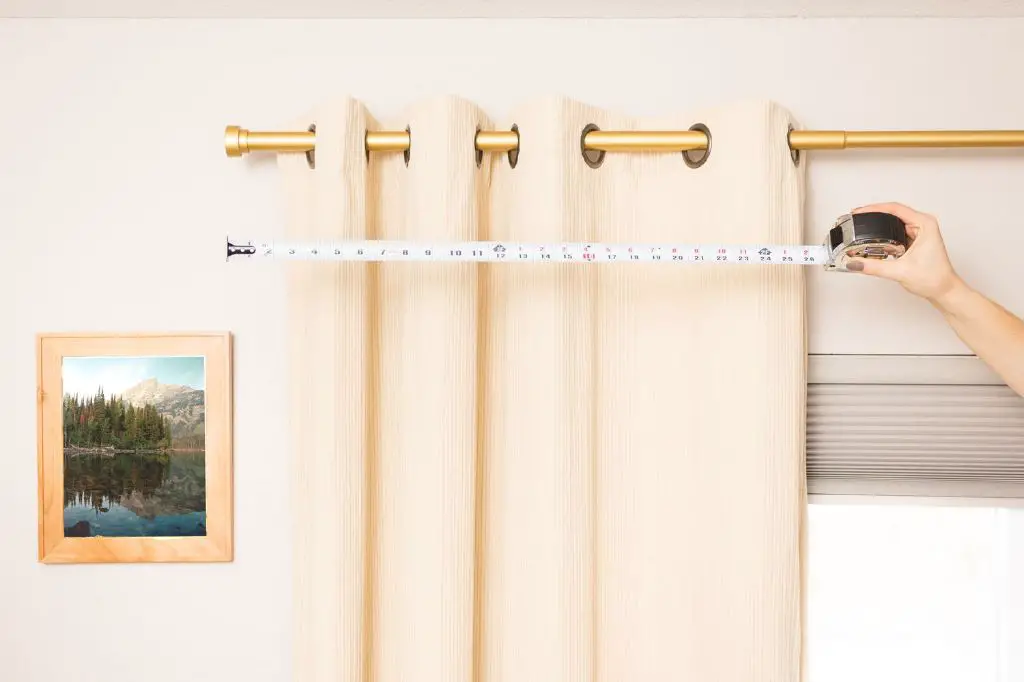 measure across the top of the window opening to determine curtain rod length