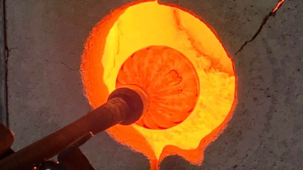 molten glass glowing orange in a glass blowing furnace