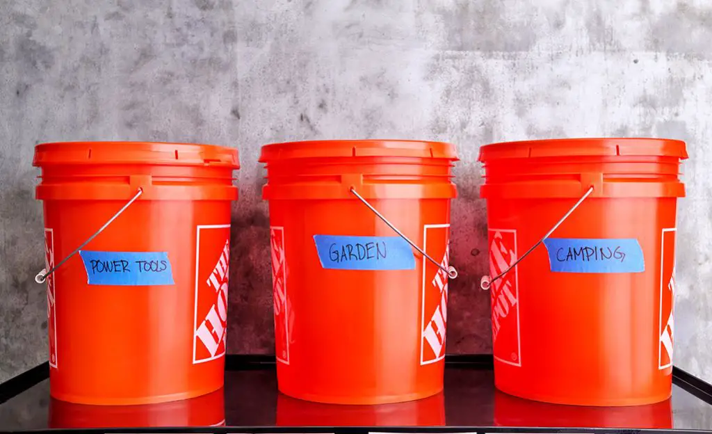 orange 5 gallon home depot bucket full of liquid