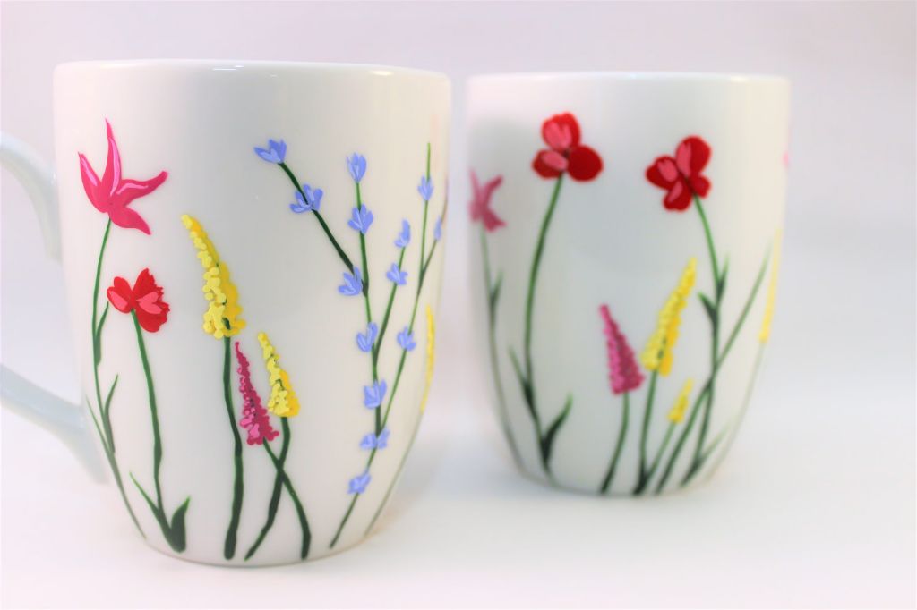 painted ceramic mug with a floral design