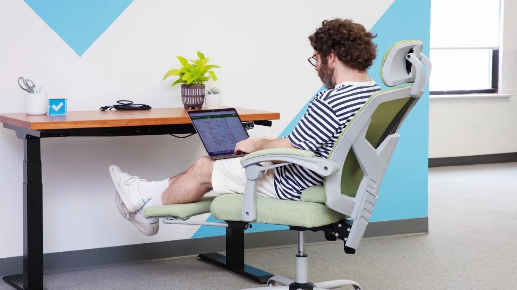 person sitting in an ergonomic office chair with swivel capability
