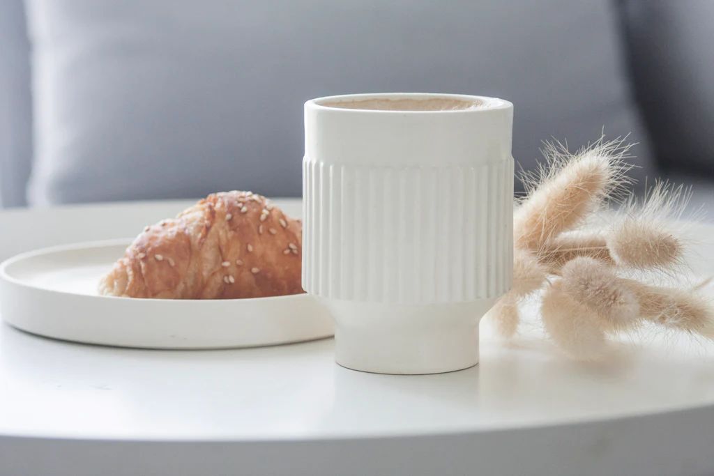 photo of curved ceramic coffee mug