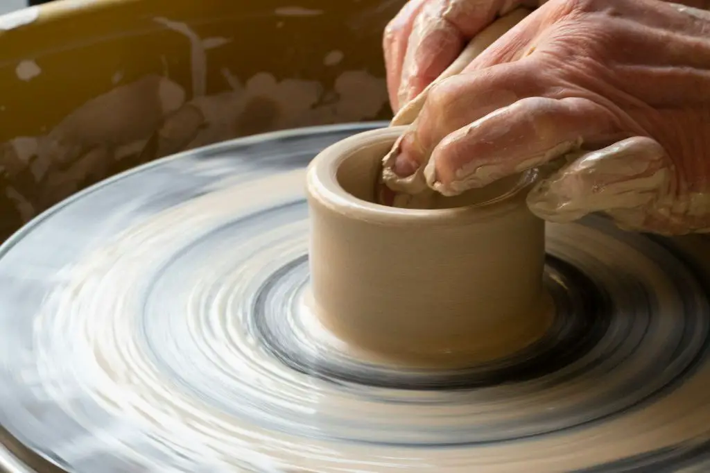 pottery techniques like wheel throwing and hand building are used to craft clay.