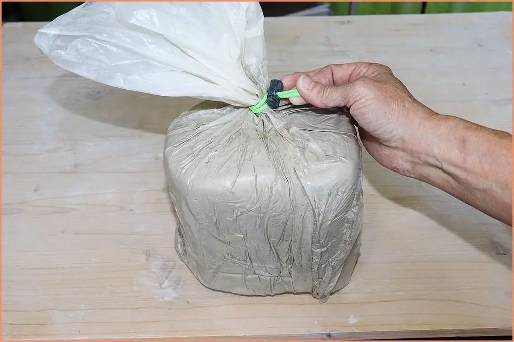 raw clay stored in sealed plastic bags